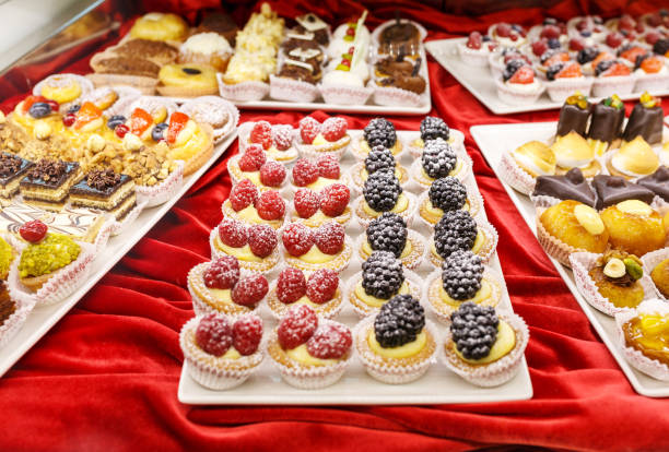 istock Different colorful Tasty beautiful cakes on a show-window in cafe 931452690