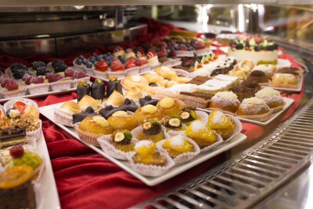 istock Different colorful Tasty beautiful cakes on a show-window in cafe 931453688