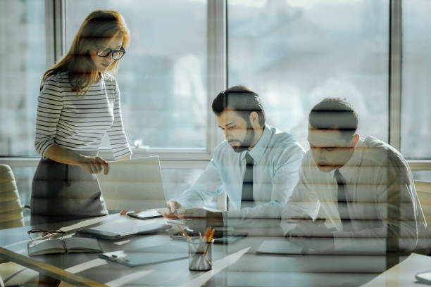 istock Young company director showing employees badly done documents 931453770