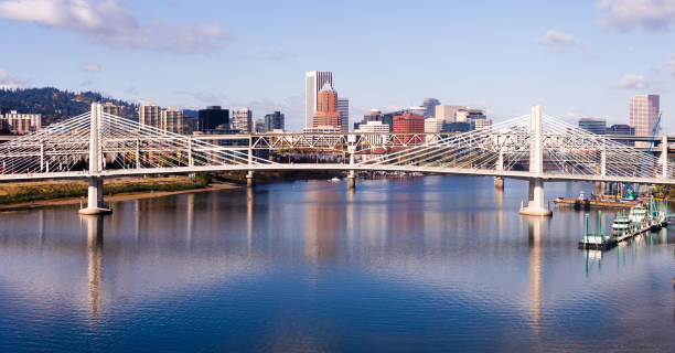 Transit Bridge Portland Oregon Downtown City Skyline Willamette River Bridges A pedestrian and transit bidge along with interstate 5  cross over the Willamette River in Portland bridge crossing cloud built structure stock pictures, royalty-free photos & images