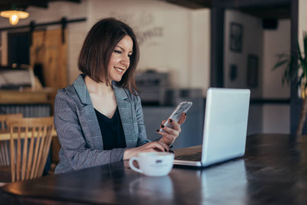 istock Woman in cafe using credit card for online payments 931459014