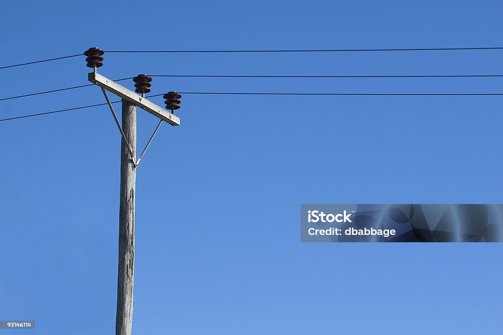 Phone lines on wooden pole  Blue Stock Photo