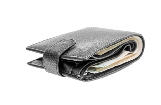 istock Closed black wallet with money isolated on white. 931465648