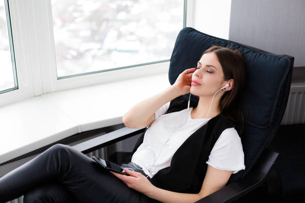 istock Beautiful woman sitting by the window 931466558