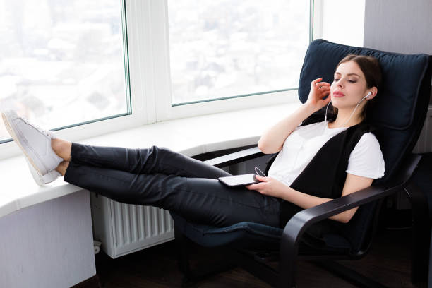 istock Beautiful woman sitting by the window 931466868