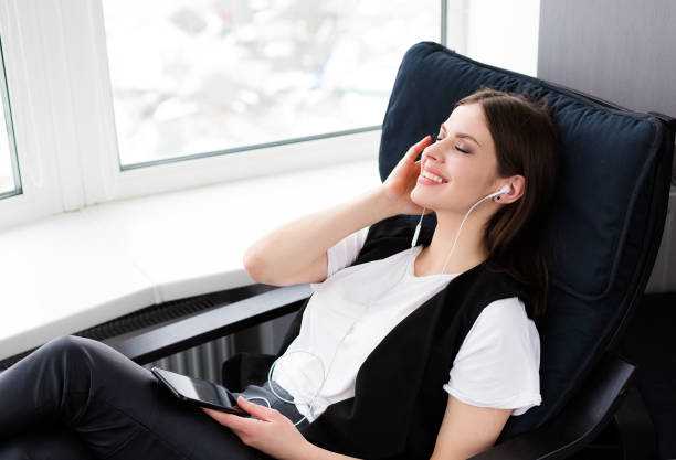 istock Beautiful woman sitting by the window 931466960