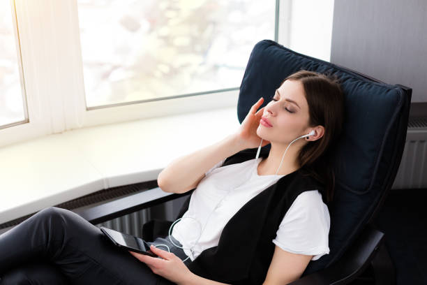 istock Beautiful woman sitting by the window 931467106