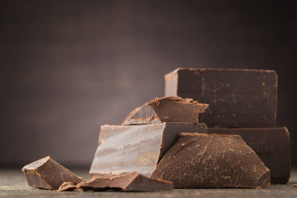istock Dark chocolate on a wooden background. chocolate 931467118