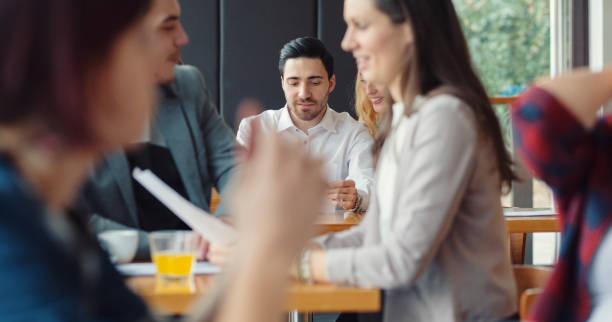 istock Group of young people in cafe 931473884
