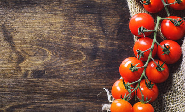 istock Branch with fresh cherry tomatoes. Ripe red tomatoes. 931476042