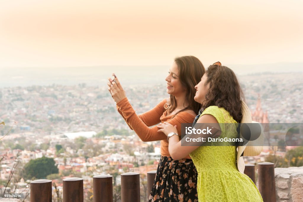 Friends traveling in Mexico Friends taking a selfie at a viewpoint in San Miguel de Allende, Mexico 20-24 Years Stock Photo