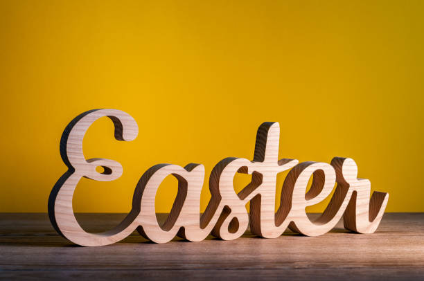 istock Word Easter made of wooden letters as a festive Easter background composition 931477016