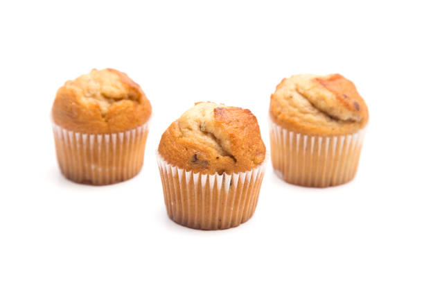 istock Classic Banana Nut Muffins on a White Background 931477234