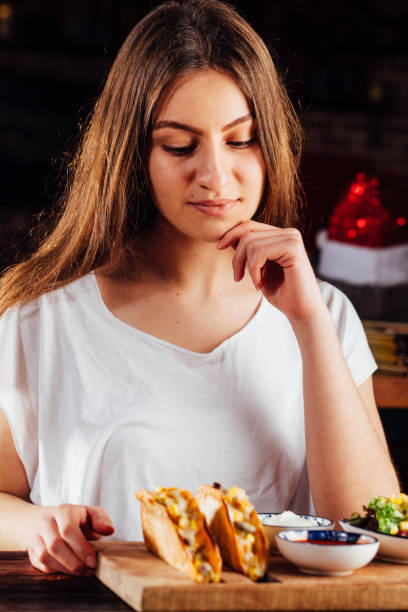istock Young woman thinking in restaurant 931477412