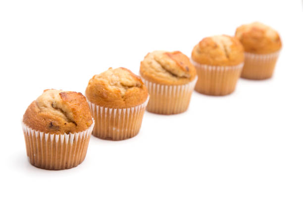 istock Classic Banana Nut Muffins on a White Background 931477460