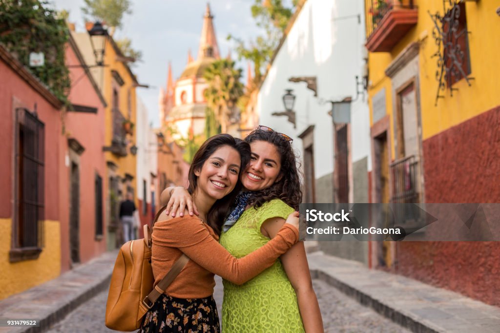Friends traveling in Mexico Friends taking a selfie at a viewpoint in San Miguel de Allende, Mexico Mexico Stock Photo