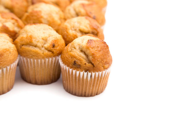 istock Classic Banana Nut Muffins on a White Background 931480490
