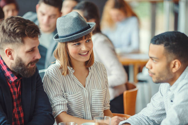 istock Group of young people in cafe 931483112