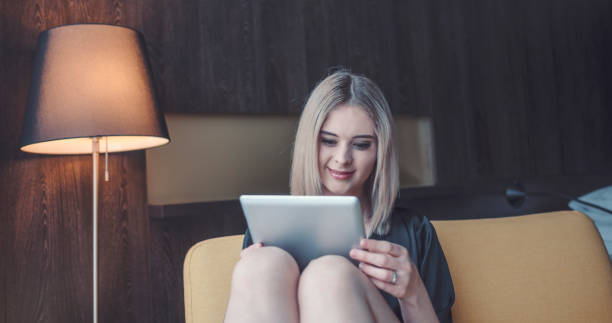 istock Young woman using digital tablet in the morning 931483374