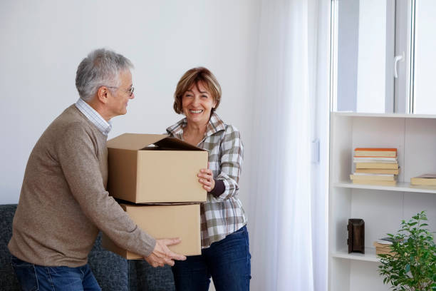 istock Senior couple moving into a new apartment 931486296