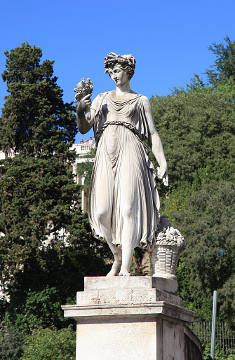 Sculpture of a woman with fruits and vegetables in the Piazza del Popolo(People's Square), Rome, Italy.
