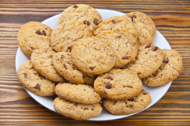 istock delicious appetizing cookies with chocolate on plate 931486850