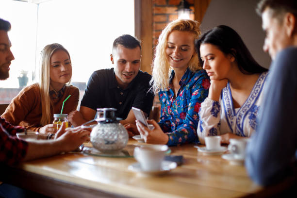 istock Colleagues from work socialising at a cafe 931491996