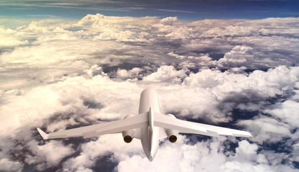 istock Rear view of private learjet aircraft flying over the clouds 931497536