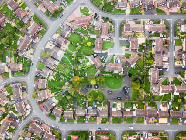 Aerial view of traditional housing estate in England. Looking straight down with a satellite image style, the houses look like a miniature village suburb photos stock pictures, royalty-free photos & images