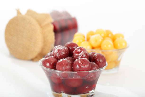 view of a bowl of cherries and a tray of wholemeal bread, in front of all five cherries