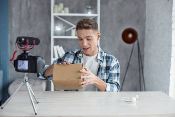 istock Happy young man opening his box 931504950