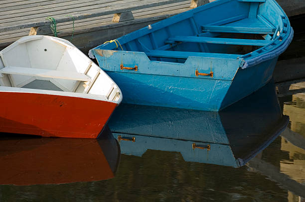row boats at dock stock photo