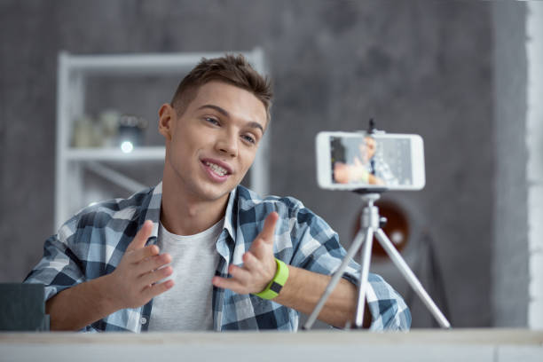istock Happy vlogger making a video for his followers 931508986