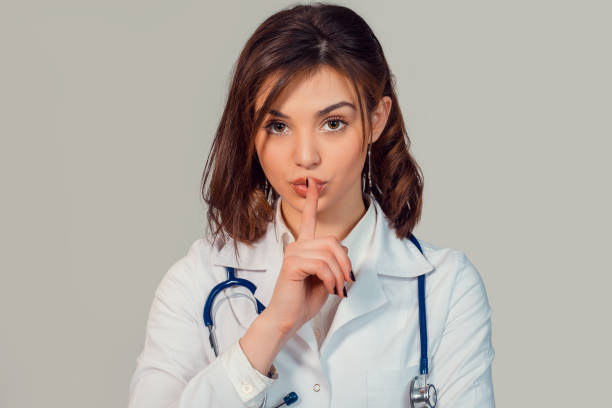 istock Doctor showing hush sign gesture with hand 931513072