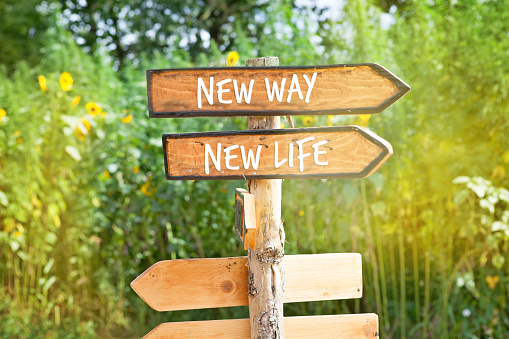 Wooden direction sign: NEW WAY, NEW  LIFE