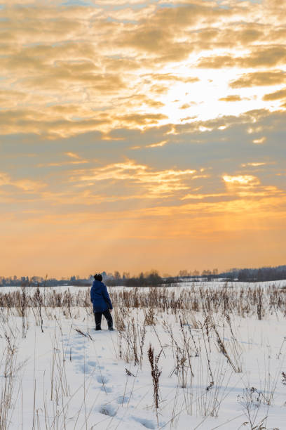istock the boy is walking on the snow 931519990