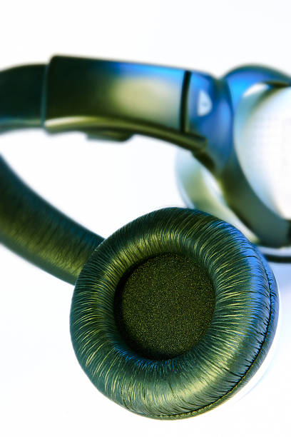 Music concept. Focus on the upper earbud. Shallow DOF!
