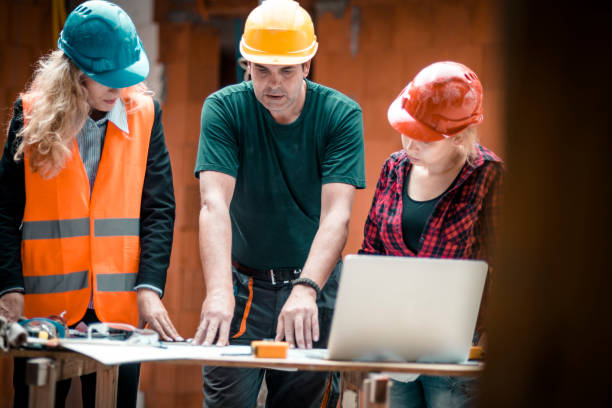istock A group of people is reviewing plans for construction work 931524024