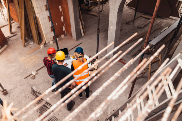 istock A group of people is reviewing plans for construction work 931524062