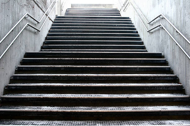 Uphill view of empty outdoor stairwell stock photo