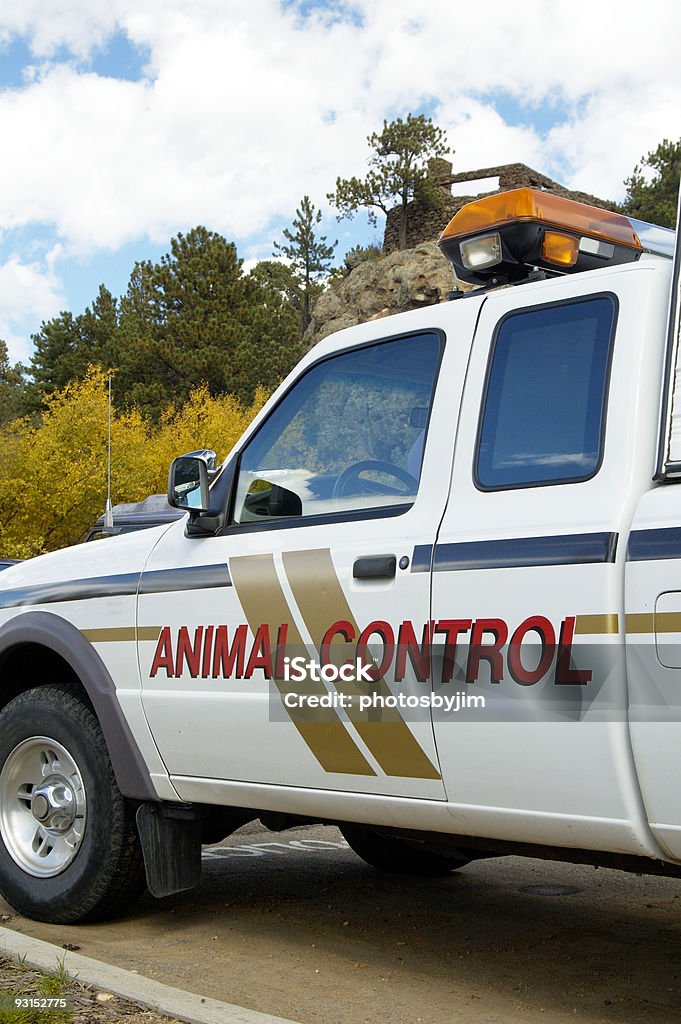 A shot of an animal control vehicle An animal control vehicle on duty in an urban setting. Control Stock Photo