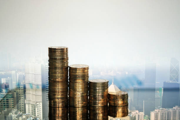 istock Double exposure Step of coins and tablet computer with financial graph and city background, business planning vision and finance analysis concept. 931538602