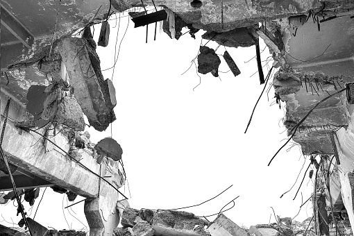 Remains of the destroyed industrial building. Black-and-white image.