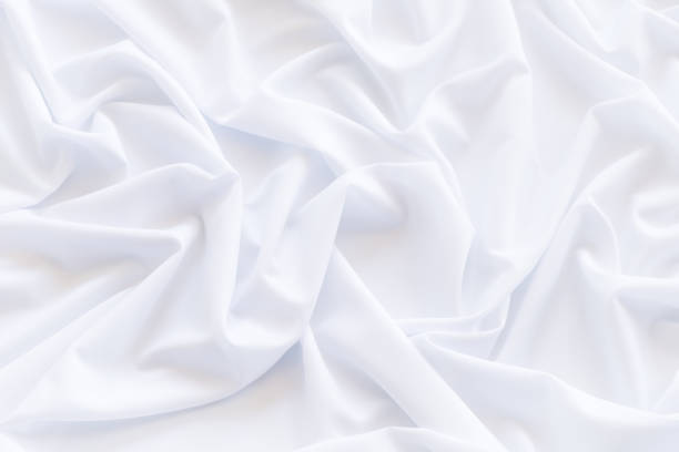istock White fabric background and texture, Crumpled of white satin for abstract and design 931539572