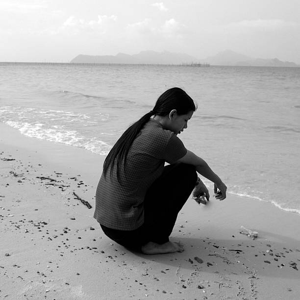 istock Young Thai Girl thinking at the beach. 93154051