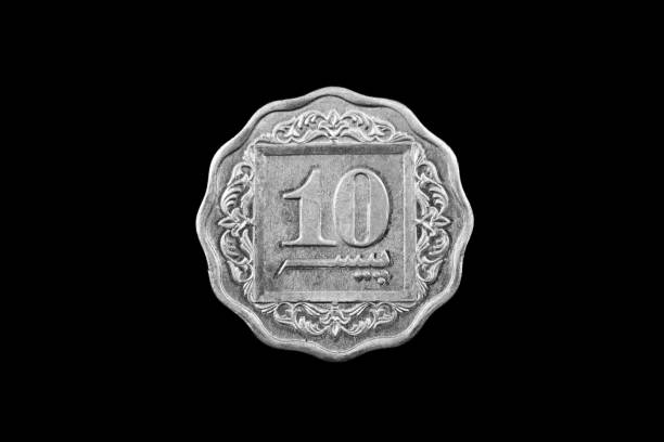 istock Old Pakistani Ten Rupee Coin Isolated On Black 931541762