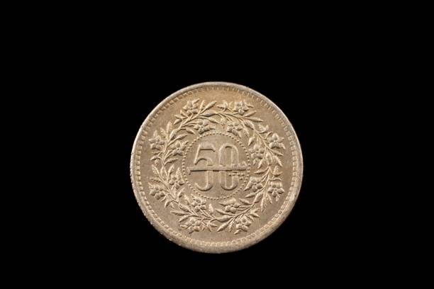 istock Old Pakistani Fifty Rupee Coin Isolated On Black 931541828