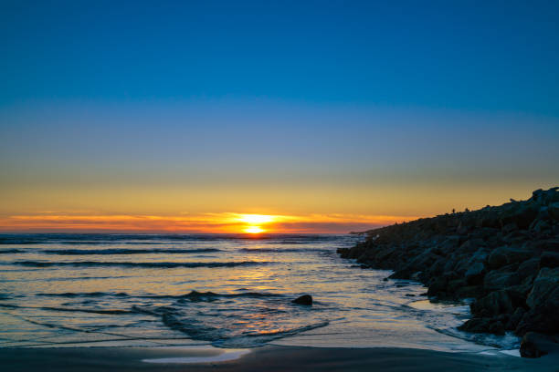 istock Ocean Sunset Along The Jetty 931542908