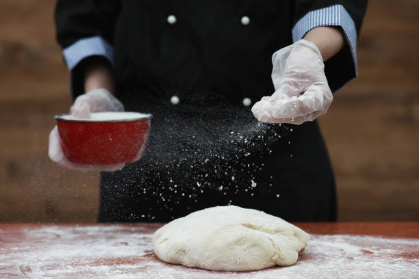 istock the cook makes flour for baking on the table 931543048