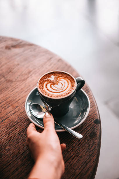 istock Latte art coffee on a grey plate from above. 931544090